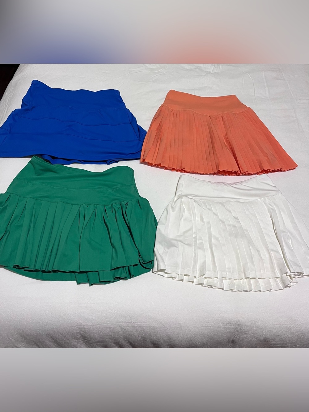 Lot of various brands Pleated Tennis Mini Skirts - Blue, Coral, Green, White.